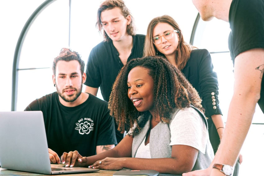 A group of college students working together to find credible sources for their research