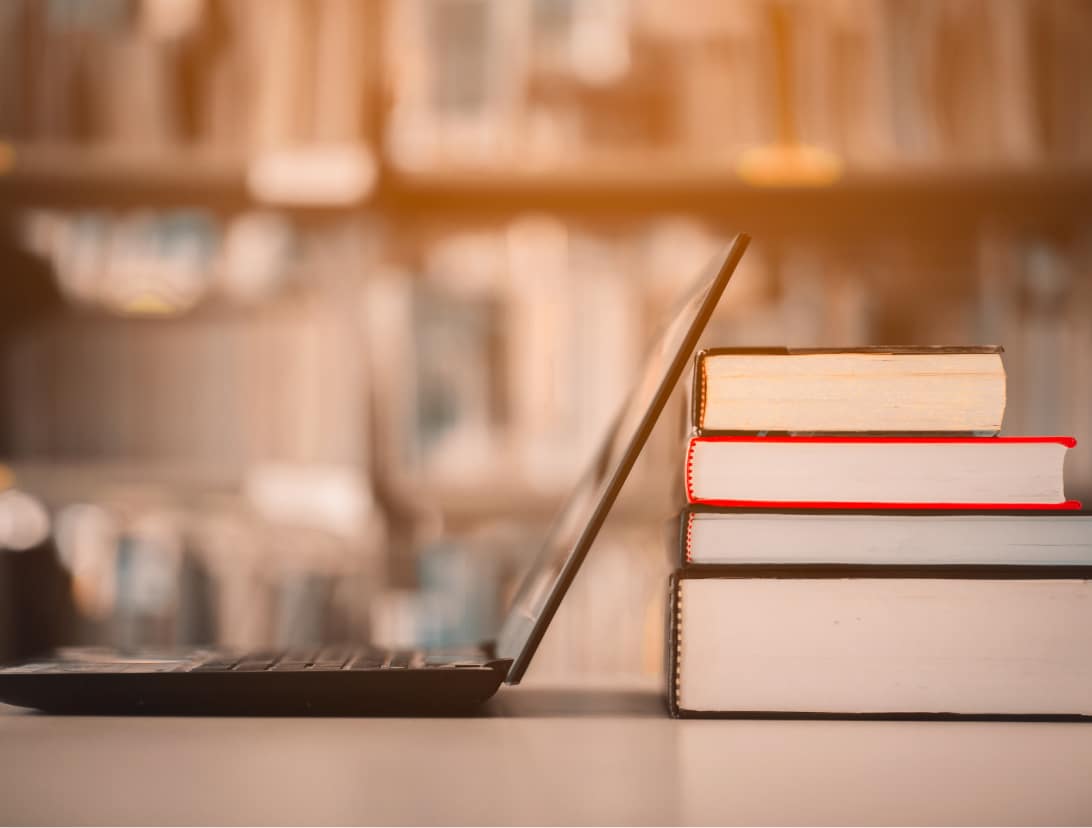 laptop and books together