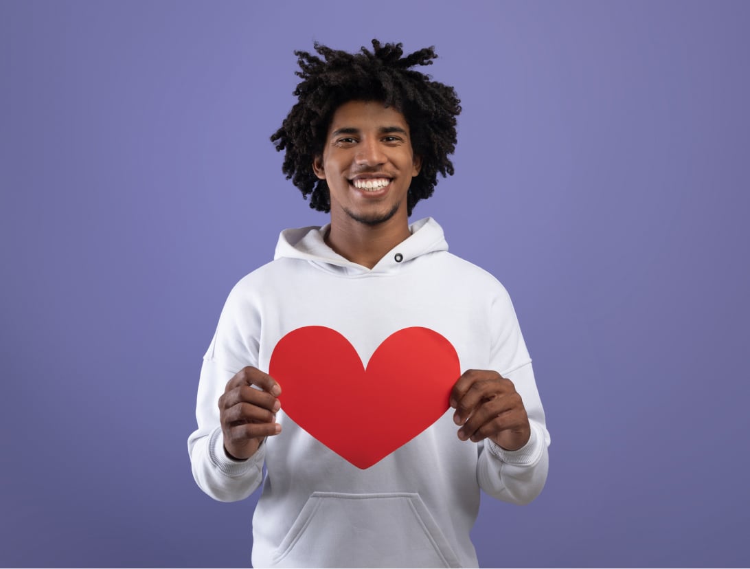 Student holding heart shape paper image