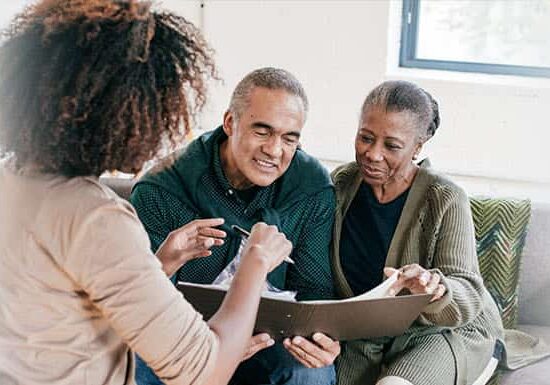 Parents reading looking for university for their daughter