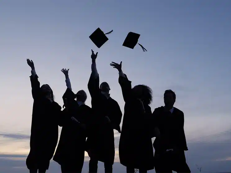 college students celebrating graduation