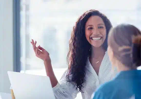 Is Human Resources a Good Career For You1 (2) a female HR professional explaining something to a colleague