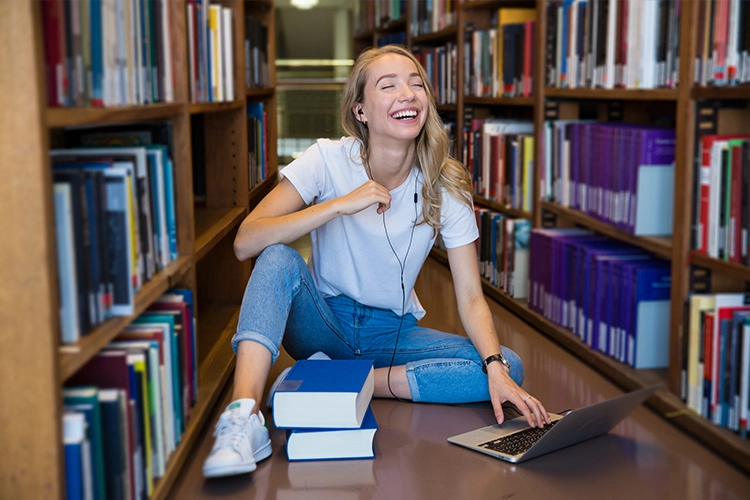 a female Finnish college student celebrating tuition-free education