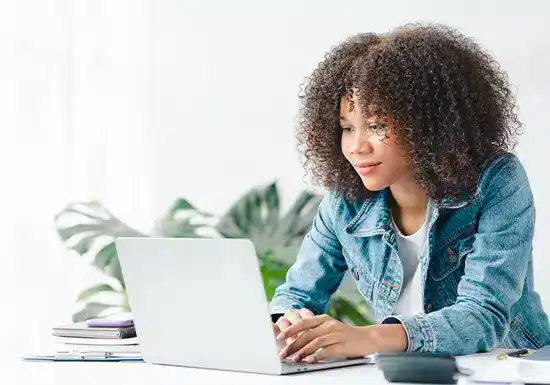 an online college student earning an MSIT degree