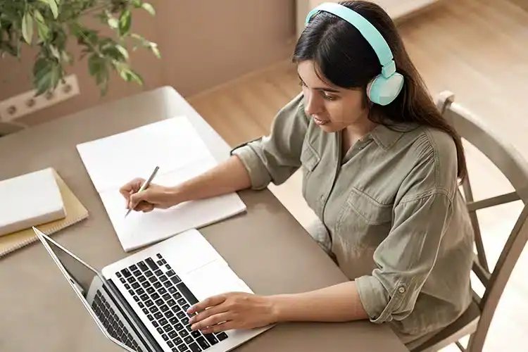 a female college student submitting her assignment online