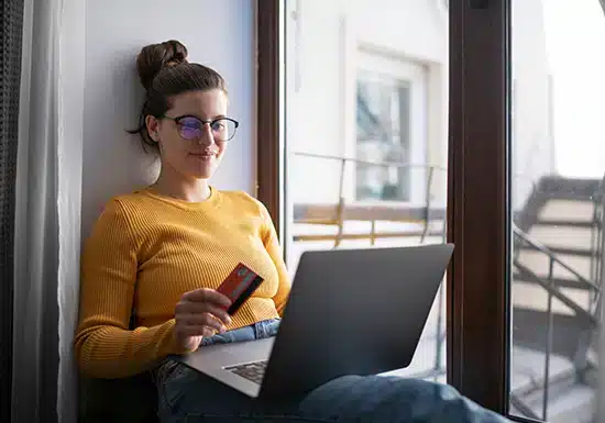 a female college student earning her degree at an affordable online American college