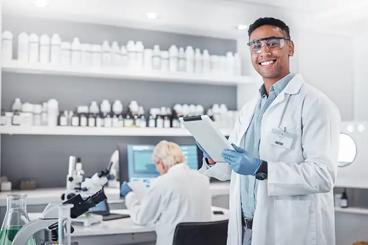 a male health science professional working in his lab