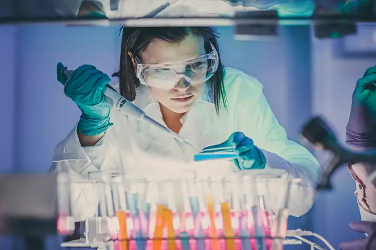 a female biologist working in her laboratory