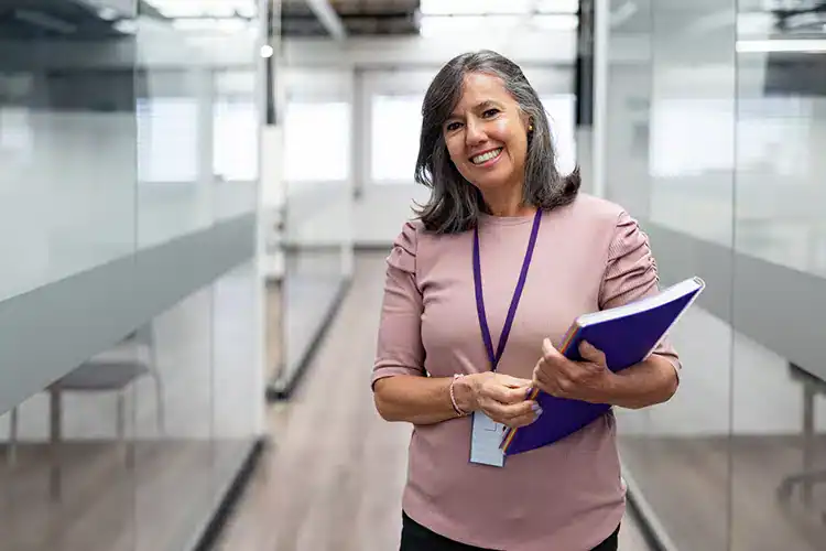 an older female student happy to be back to school for her master's degree