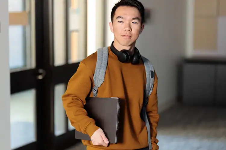 a male college student about to take his online class