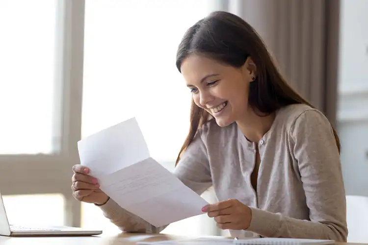 a female college student happy to have received a scholarship