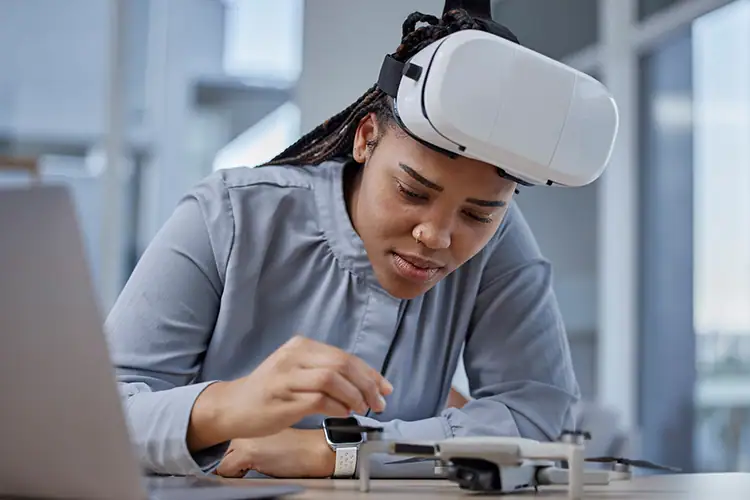 Young woman wearing a virtual reality headset engaging with technology in a modern learning environment.