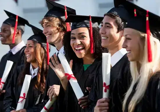 happy college grads posing for a group picture 